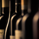 Wine bottles in line after going through a bottle labeling machine.