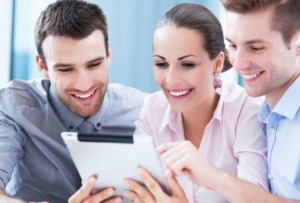 Business people looking at digital tablet