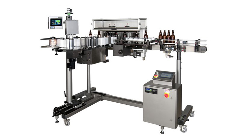 Automatic Bottle Labeling Machine–Vertical Trunnion Roller--loaded with beer bottles.