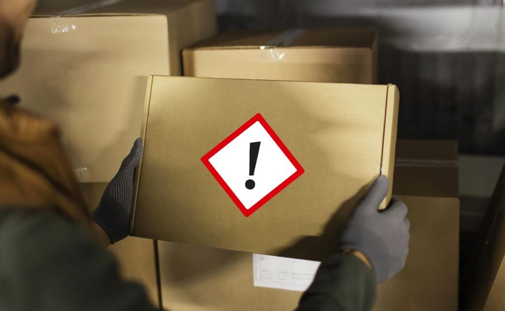 A package labeled with a GHS symbol for hazardous chemicals.