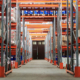 Warehouse racks full of various labeled inventory.