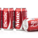 Four Coca Cola Classic cans displaying personalized labels that read “Dude, Bestie, and Mate.”